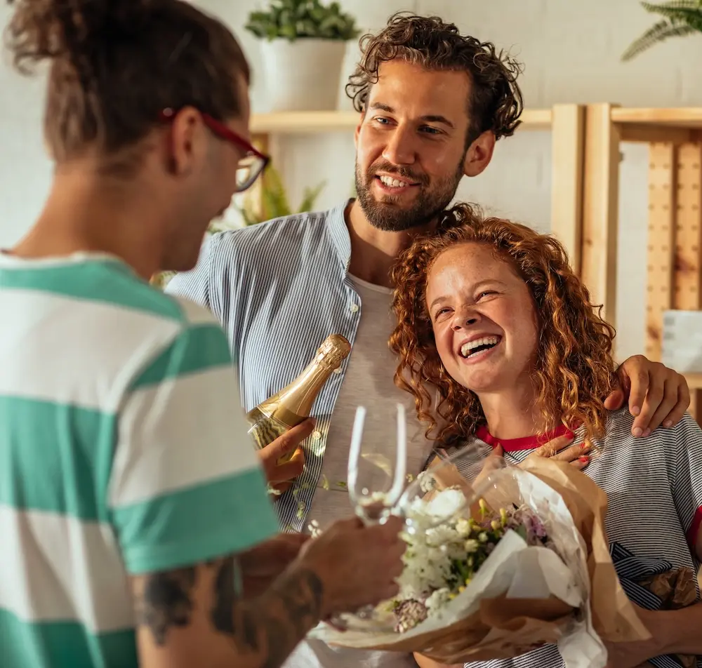 People celebrating at housewarming party.