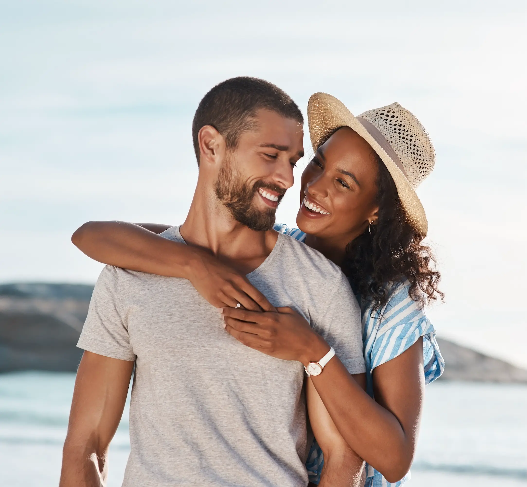 Engaged couple by the ocean. 